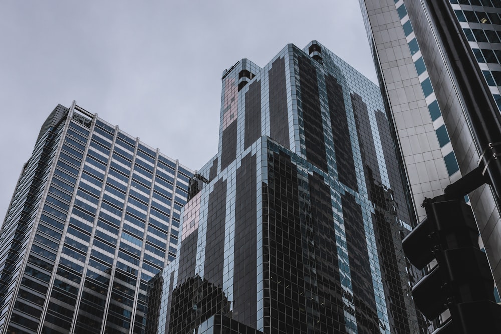 three tall buildings during daytime