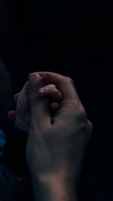 Close-up of hands gently holding, capturing trust and connection.