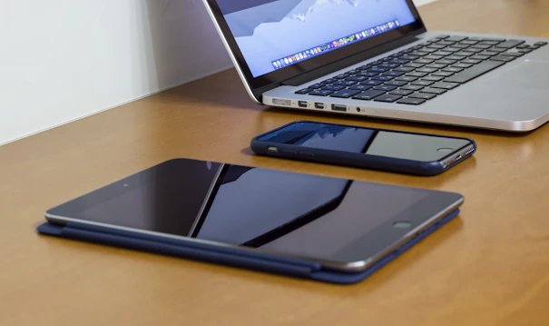A sleek office setup with multiple communication devices displaying connectivity.