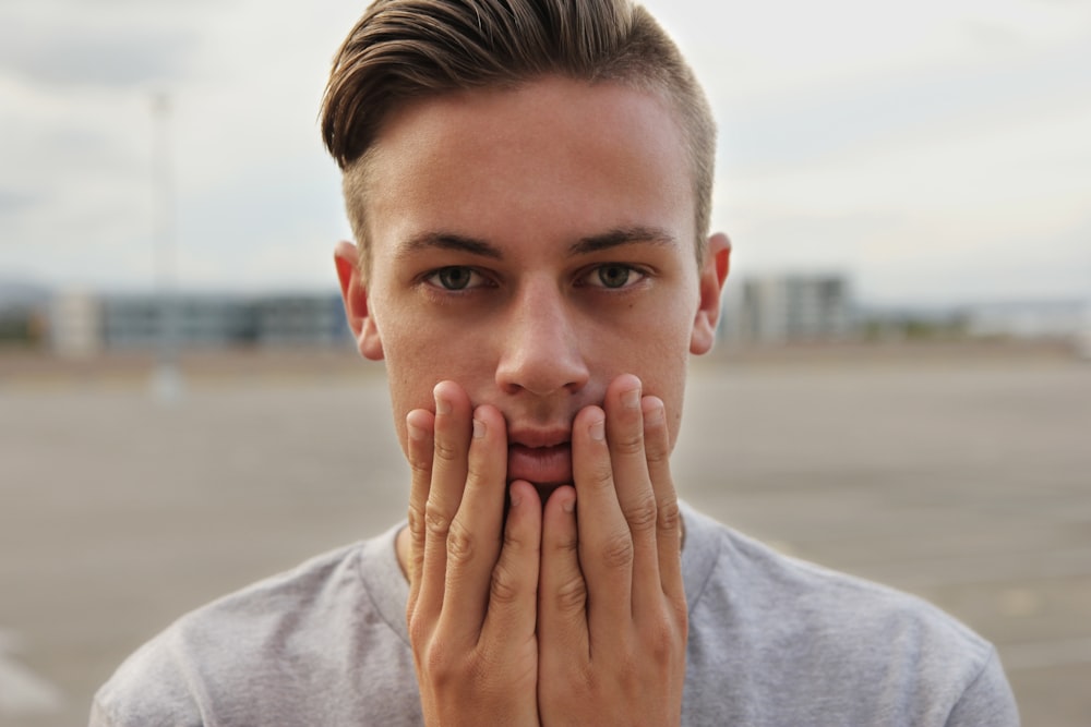 man holding face