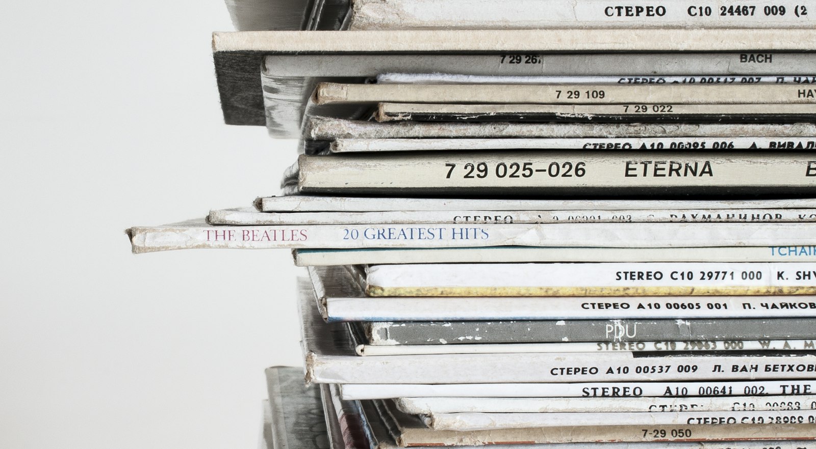 Stack of vintage vinyl records, evoking the music and Old Hollywood worlds of Taylor Jenkins Reid's novels