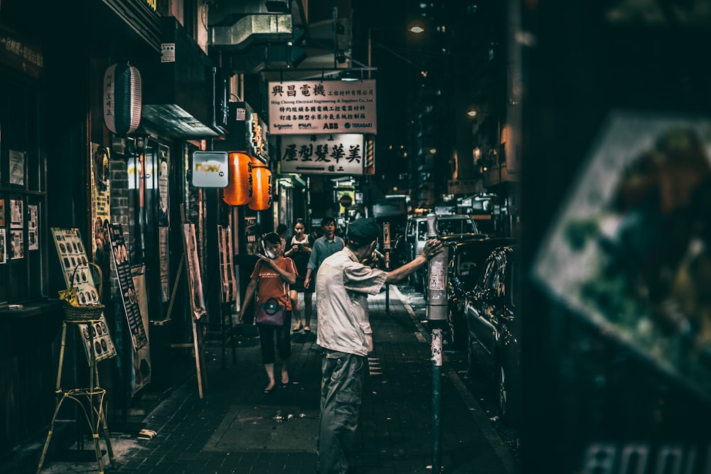 people on street between stores