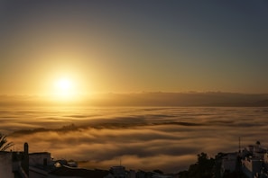 Sunrise view over the misty hills surrounding Kanchankanya Hill Resort