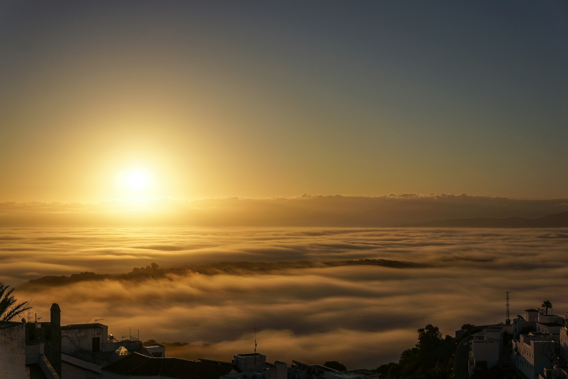 woman wearing yellow long-sleeved dress under white clouds and blue sky during daytime