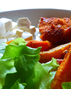 Side-by-side comparison of a raw food photo and its polished, cinematic reel frame with enhanced lighting and textures.