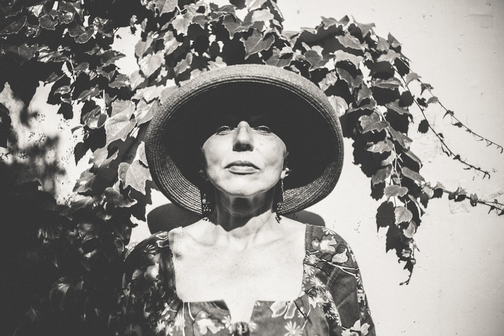 grayscale photo of woman wearing hat