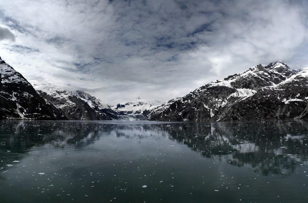 body of water near mountains