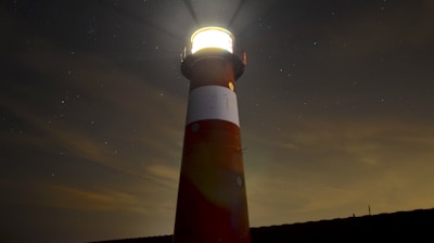 low angle view of red and white lighthouse