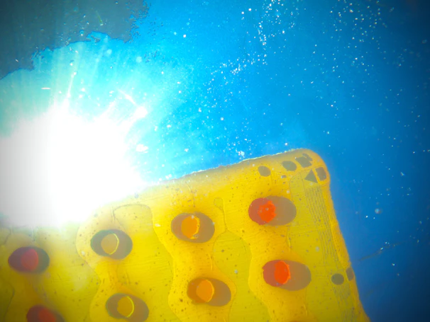 A sunny backyard scene featuring a family enjoying a puff pool party with inflatable pools and bright decorations.