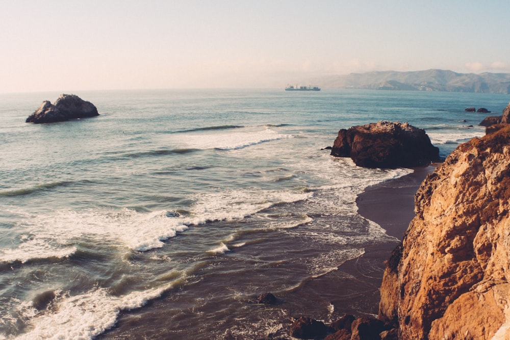 body of water near rocks