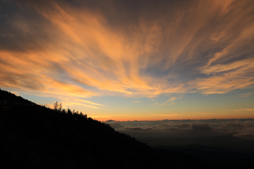 aerial photography of mountain range under golden hour