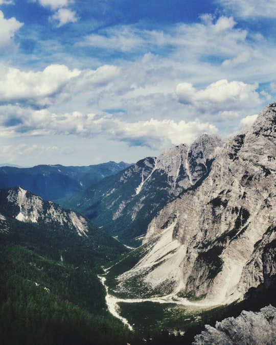 mountain range under clouds in Triglav National Park Slovenia