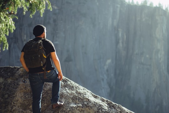 man standing on gray stone in Yosemite National Park United States