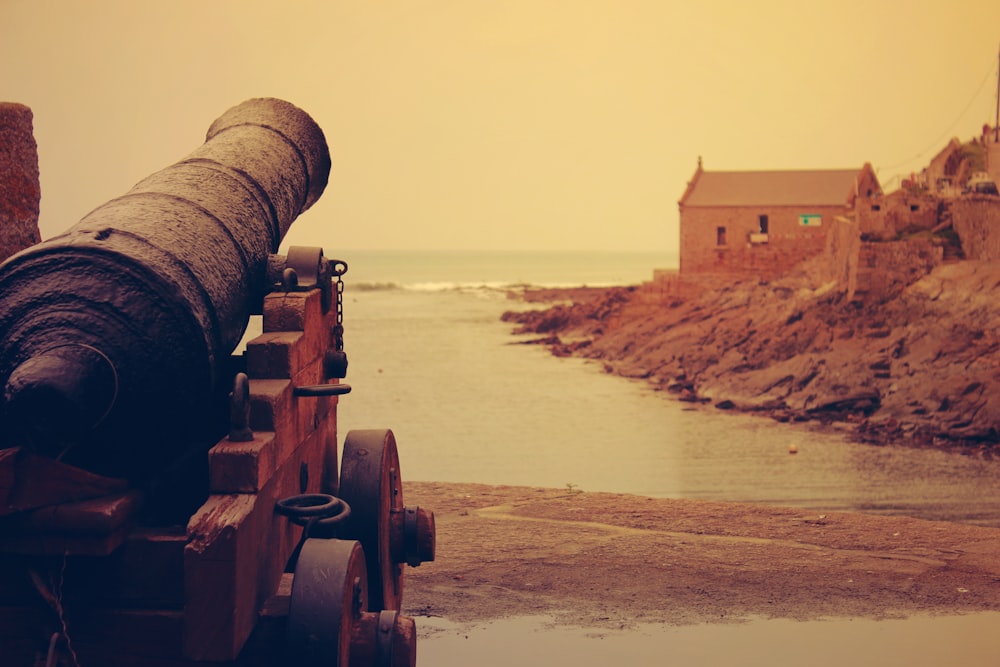 canyon aiming body of water near brown house