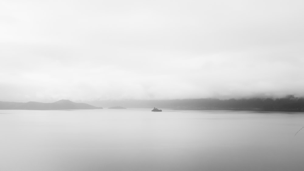 grayscale photo of a body of water
