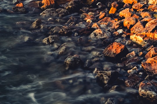 water hitting the rocks in Rest Bay United Kingdom