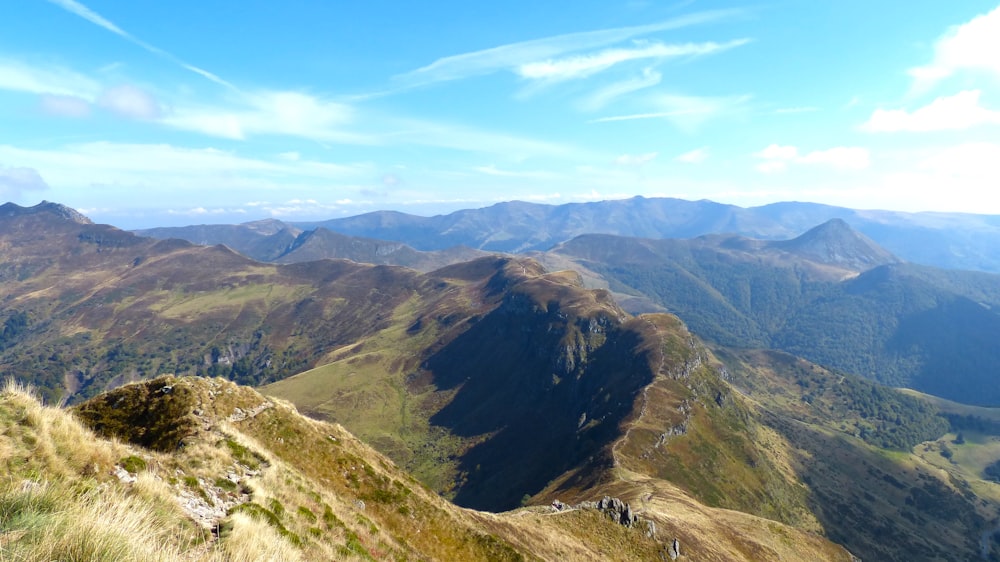 landscape photo of green mountains at daytime