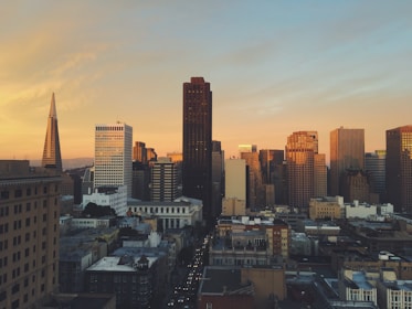 A skyline view of New York City with a focus on residential buildings bathed in sunset light.