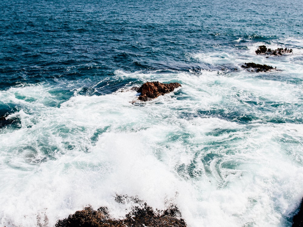 rocks on body of water