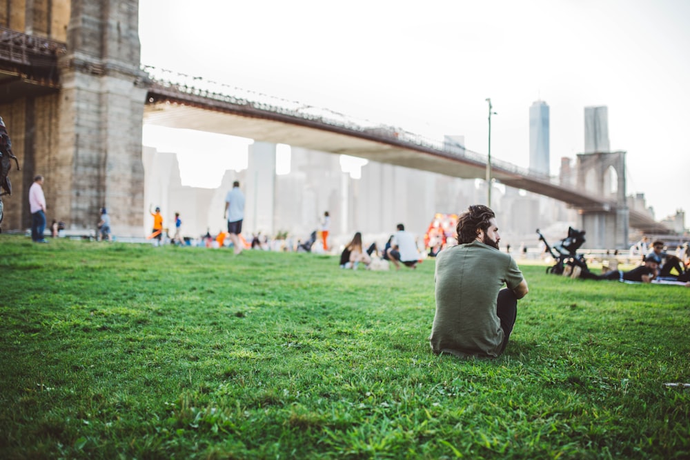 men's gray crew-neck t-shirt sitting on the grass