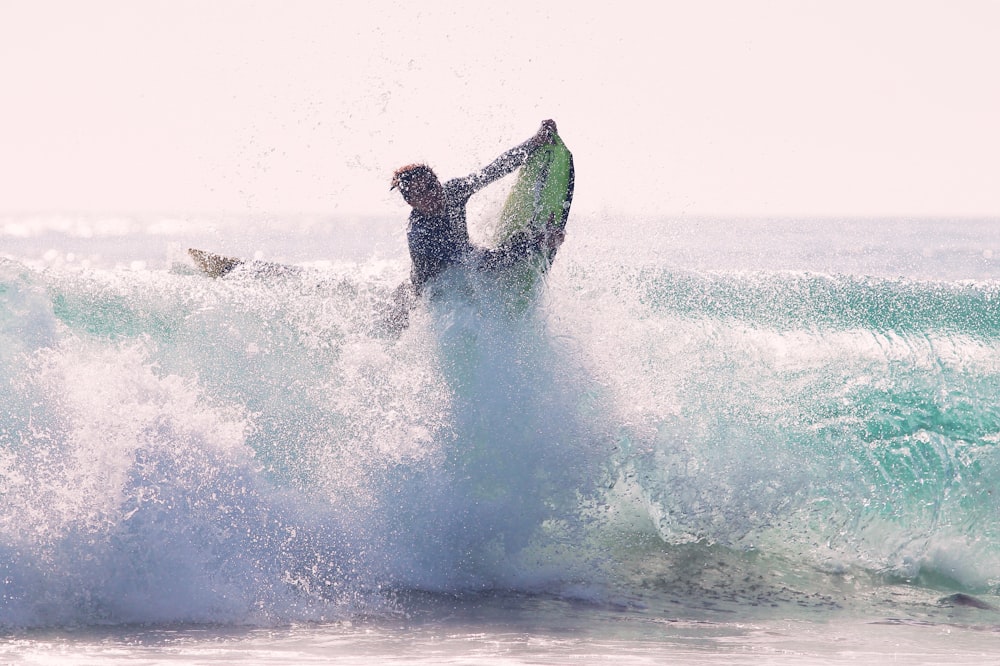 man riding bodyboard