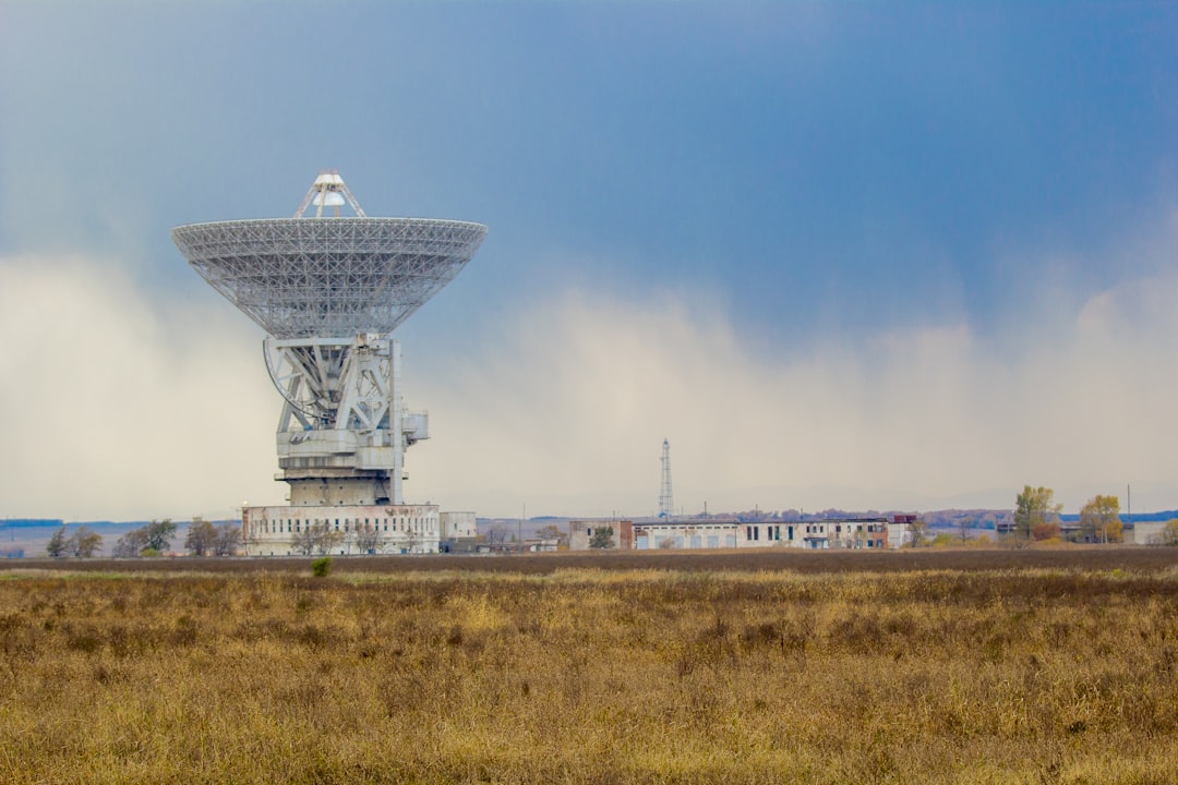 landscape photography of white satellite, Satellite Antenna RT-70 (One of the biggest ratio telescope in the world)<p></figure>in Galenki (Near Ussuriysk city) Primorsky Kraym Russia.</p><p>RT-70 is realy big. Diametr is 70 m. Antenna highs his around 90 meters. Construction weight 5000 tonns.</p><p>From this complex was sent last command, command to descend for space station Mir.