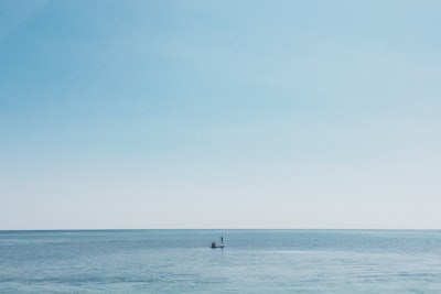 boat on body of water clean teams background