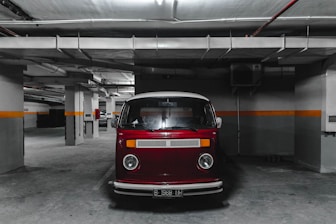 white and red car parking on parking lot