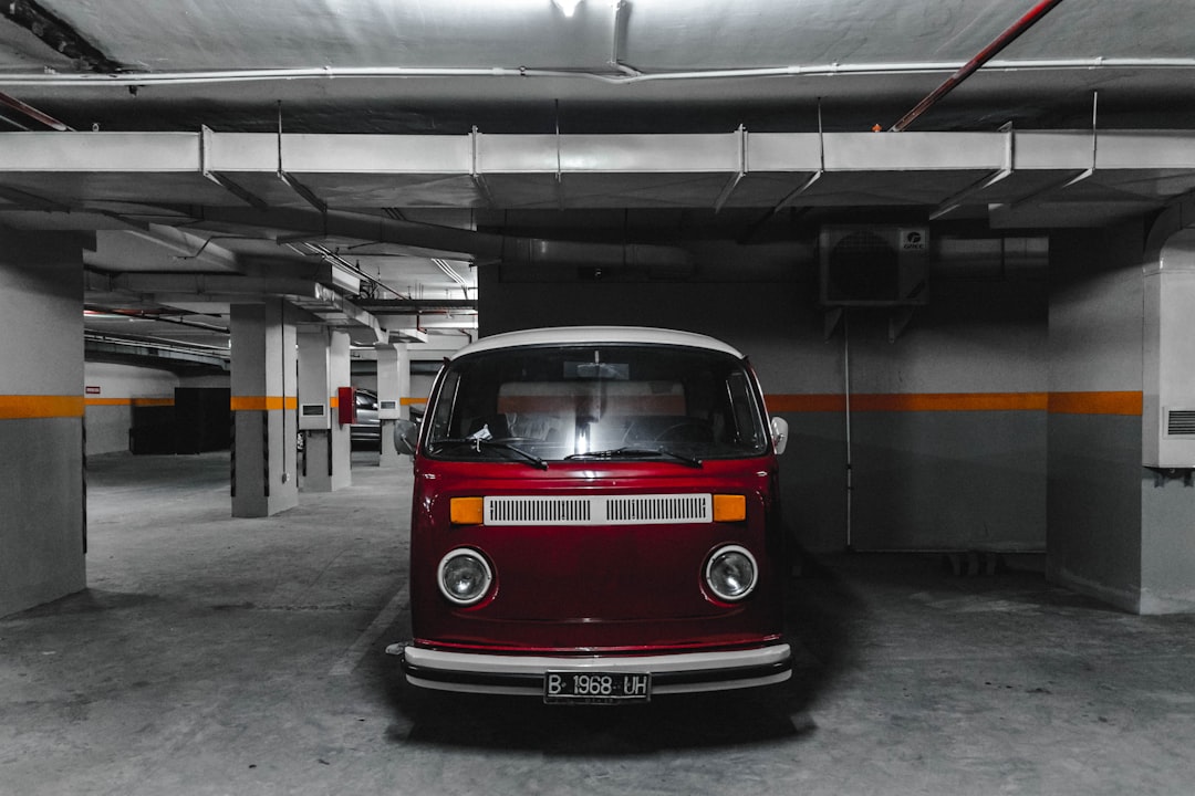 white and red car parking on parking lot