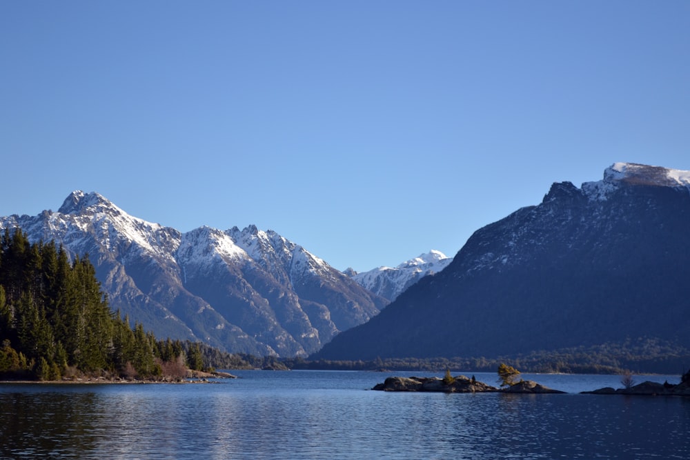 body of water under blue sky