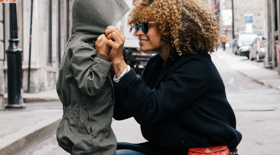 woman holding kid at the street