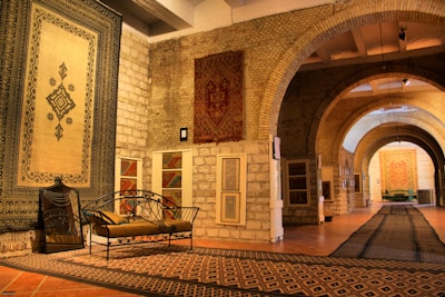 A hotel lobby showcasing stylish rugs and furnishings imported by alkaserly.com.