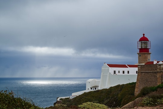 lighthouse near body of water in Sagres Portugal