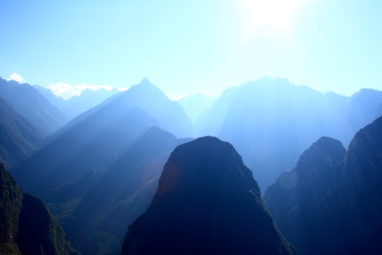 silhouette mountains during daytime in Mountain Machu Picchu Peru