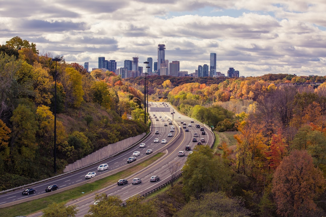 aerial photography of passing vehicles on highway leading to city, Busy daytime traffic at Leaside Bridge