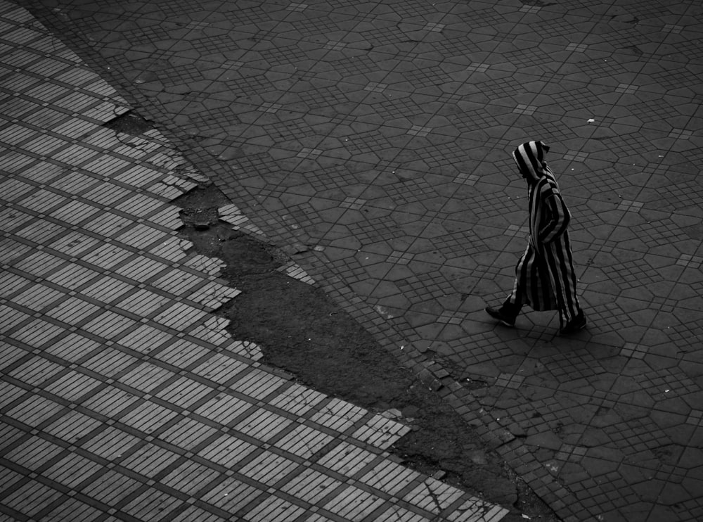 person walking on road