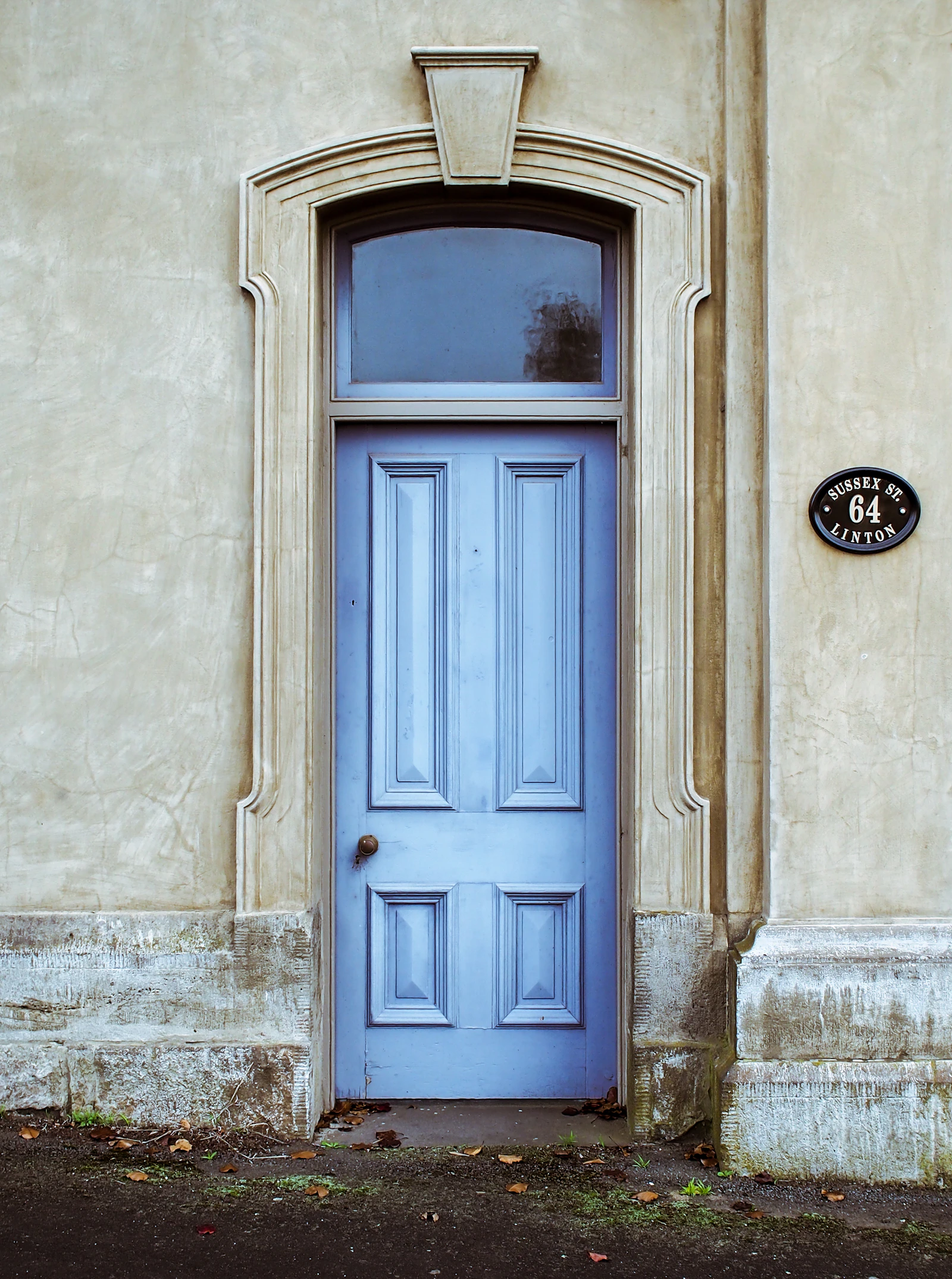 A doorway seen from inside a dim hallway, suggesting the same threshold crossed again and again
