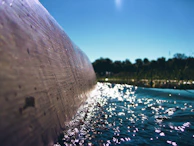 Close-up of water ripples sparkling under natural light inside the cenote.