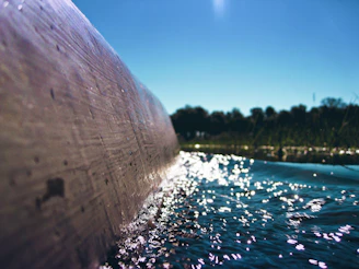 Close-up of water ripples sparkling under natural light inside the cenote.