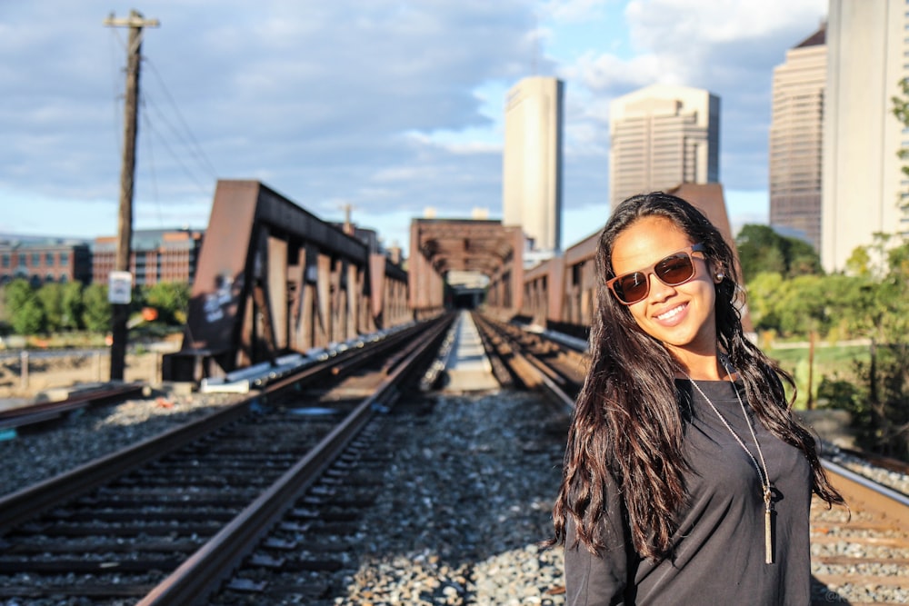 woman standing on railings