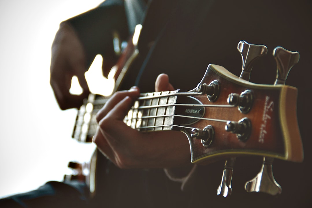 person playing guitar, Hands on a guitar neck