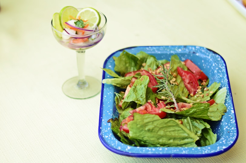 green vegetable salad on blue ceramic bowl