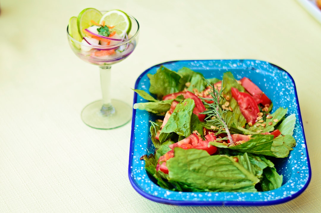 green vegetable salad on blue ceramic bowl