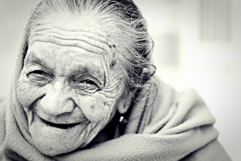Happy senior woman smiling warmly outdoors