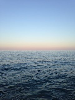 ocean near blue sky at daytime