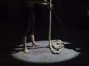 man holding brown rope