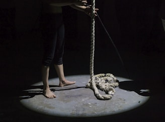man holding brown rope