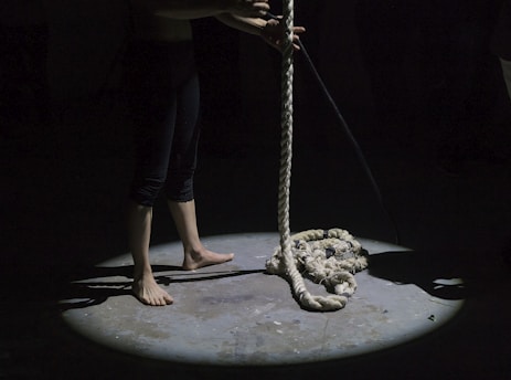 man holding brown rope