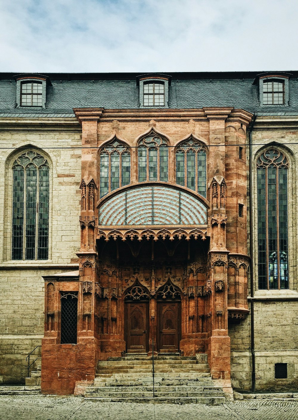 architectural photography of brown stone building