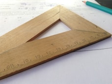 brown wooden triangle ruler